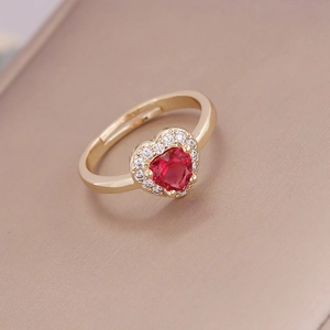 18K gold heart-shaped red zircon ring with micro-paved diamonds in a minimalist style