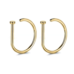 Detailed view of gold-plated D-shaped nose rings with flat disc ends on white background