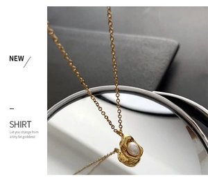 Macro detail of natural freshwater pearl pendant on a gold irregular lava base necklace