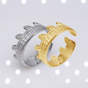 Detailed close-up of gold and silver adjustable open rings with leaf texture