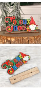 Detail of DIY wooden Christmas gnome ornament with Joyeux Noel text on a natural stump