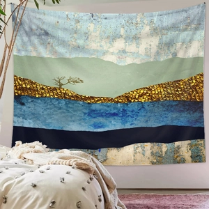 Detail of modern abstract tapestry featuring golden scales and mountain silhouette