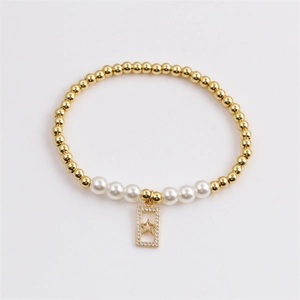 Elegant gold beaded pearl bracelet featuring a zircon-studded star charm in frame