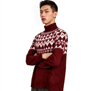 Detailed view of burgundy geometric jacquard pattern on a men's turtleneck sweater