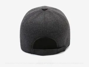 Detail view of the back of a dark grey wool baseball cap showing thick warm texture