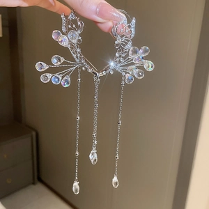 Elegant butterfly ear cuff with silver crystal tassels and shimmering rhinestones