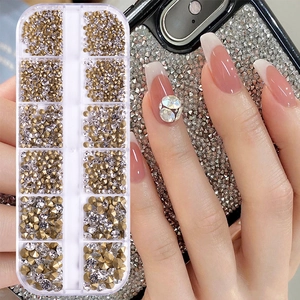 Sparkling crystal nail art rhinestones kit with gold base in a 12-slot storage case