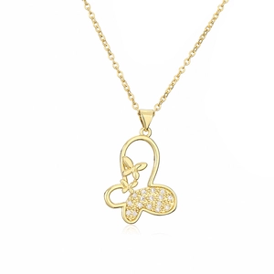 Minimalist gold plated butterfly pendant necklace with zircon stones on white background