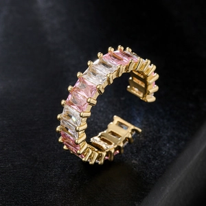 Adjustable gold ring with alternating pink and white baguette-cut zircon gemstones