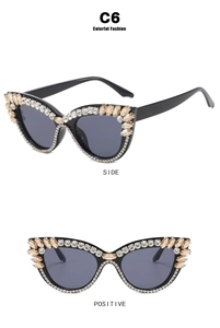 Cat eye sunglasses with rhinestones in black frame and champagne crystals, side and front view