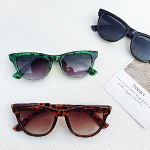 Detailed top view of trendy square sunglasses in black, green spotted, and tortoiseshell
