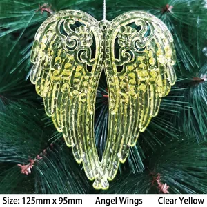 Macro view of clear yellow angel wing pendant measuring 125x95mm on Christmas tree