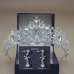 Detailed view of silver bridal crown and matching 5cm long crystal drop earrings