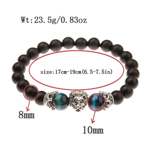 Men's black matte bead bracelet with blue tiger eye stones and silver lion head charm