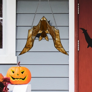 Detail of bat-shaped acrylic suncatcher with chain for Halloween porch decoration