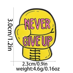 Yellow enamel boxing glove pin with Never Give Up text and size weight dimensions