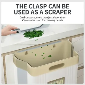 Hanging kitchen trash can for cabinet door with built-in scraper tool in white plastic