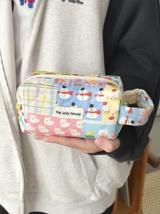 Quilted octagonal stationery storage bag with colorful cartoon prints and side handle