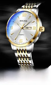 Close-up of quartz watch featuring two-tone steel band and dual day-date display