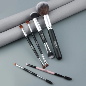 Detail of 6-piece professional makeup brush set with soft bristles and pink handles