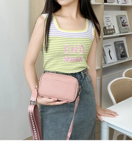 Pink crossbody camera bag with litchi texture and wide geometric pattern strap