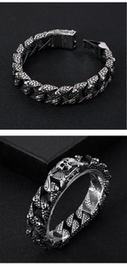 Macro view showing the 316L Stainless Steel engraving on punk skull bracelet link