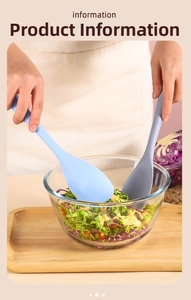 Action shot of blue and gray silicone salad spoons mixing fresh vegetables in a bowl