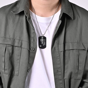 U.S. Army dog tag and silver bullet double layered stainless steel necklace on a model