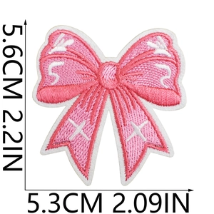 Pink embroidered butterfly bow patch with dimensions 5.6cm x 5.3cm shown on white background