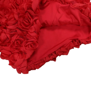 Detail of red 3D rose fabric and fine stitching on a fashion mini skirt for women