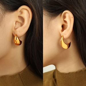 Minimalist golden teardrop earrings for women featuring a polished metallic drop design