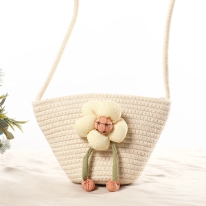 Cream cotton woven shell crossbody bag featuring a 3D plush sunflower for beach vacations