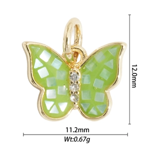 Macro view of gold butterfly pendant with green mosaic inlay and zircon accents
