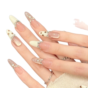 Pink almond press-on nails with leopard patterns, cat-eye finish, and rhinestone accents