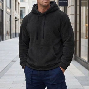 Close-up of black sherpa fleece hoodie fabric texture and urban street style design