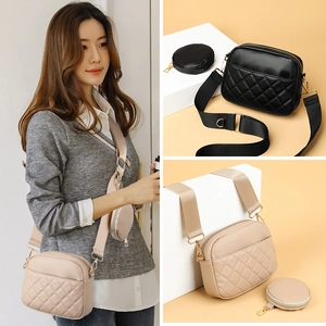 Quilted women's crossbody bag with wide strap and round coin purse in black and beige