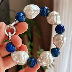 Detail of baroque pearl and lapis lazuli bracelet with a crystal encrusted silver clasp