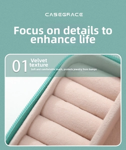 Detail of teal jewelry box with soft pink velvet lining and ring storage slots