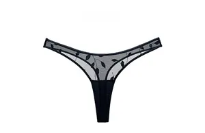 Detailed close-up of leaf embroidery on black sheer mesh lace thong for women
