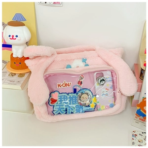 Detail view of pink plush bunny ear tote bag with clear PVC window for pin collection