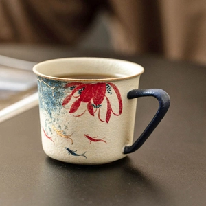 Hand-painted blue lotus and koi ceramic coffee mug with gold-rimmed blue handle