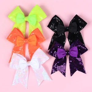 Set of five large sequin bow hair clips in neon green, orange, white, black and purple