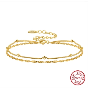 Detailed close-up of S925 sterling silver certification mark on double-layer gold bracelet