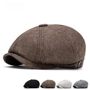 Detailed macro view of the vintage plaid newsboy hat featuring textured fabric and stitching