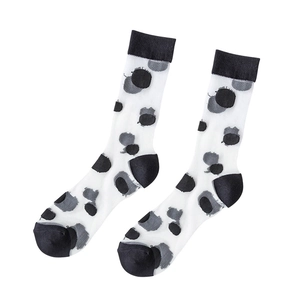 Transparent black and grey polka dot mesh socks with solid black heel and toe details
