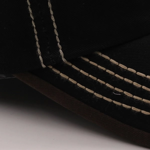 Detail view of cotton baseball cap showing durable white contrast double stitching