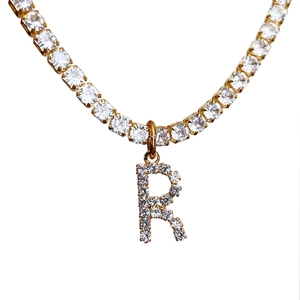 Gold letter R pendant necklace with sparkling cubic zirconia on a dainty chain