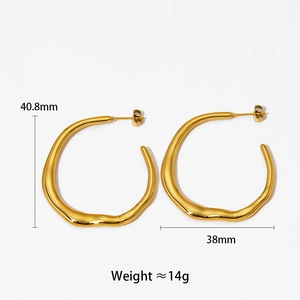 Detail view of gold-plated irregular wavy hoop earrings with size 40.8mm measurements
