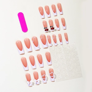 French tip press-on nails with 3D cherry and bow accents including tool kit