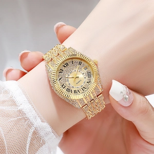 Luxury gold quartz watch for women with full diamond inlay and calendar display